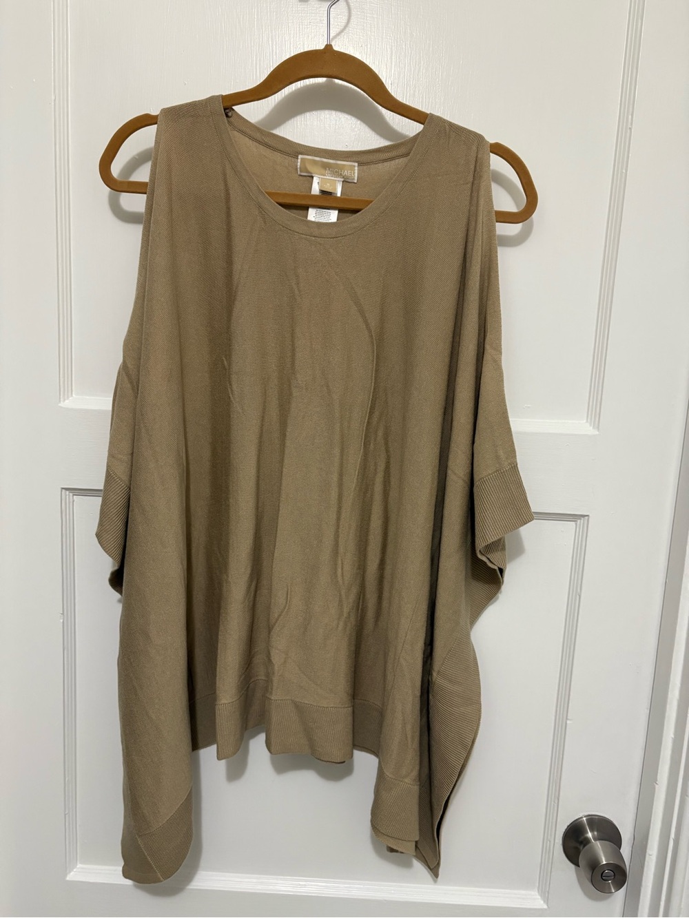 beige Michael Kors poncho top with a cold shoulder design